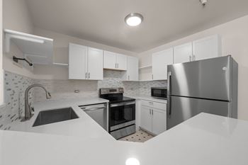 Kitchen with refrigerator